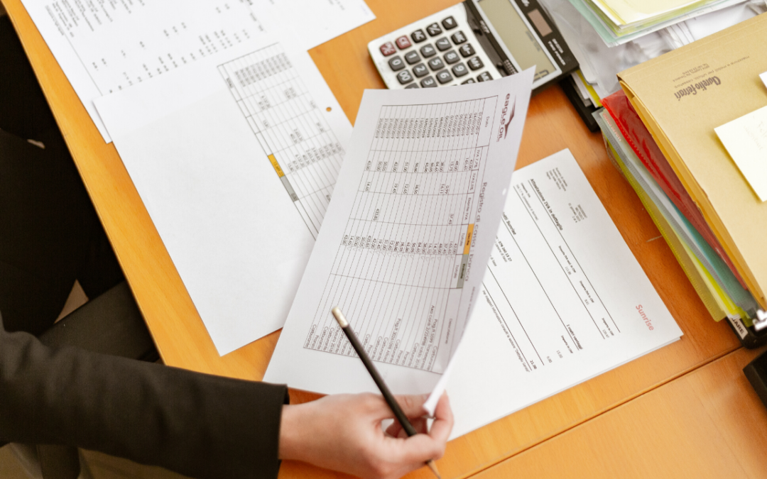 picture of women holding spreadsheet